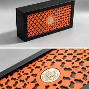 Stylish Black & Orange Hollow Carved Magnetic Box with Gold Emblem for Luxury Cosmetics