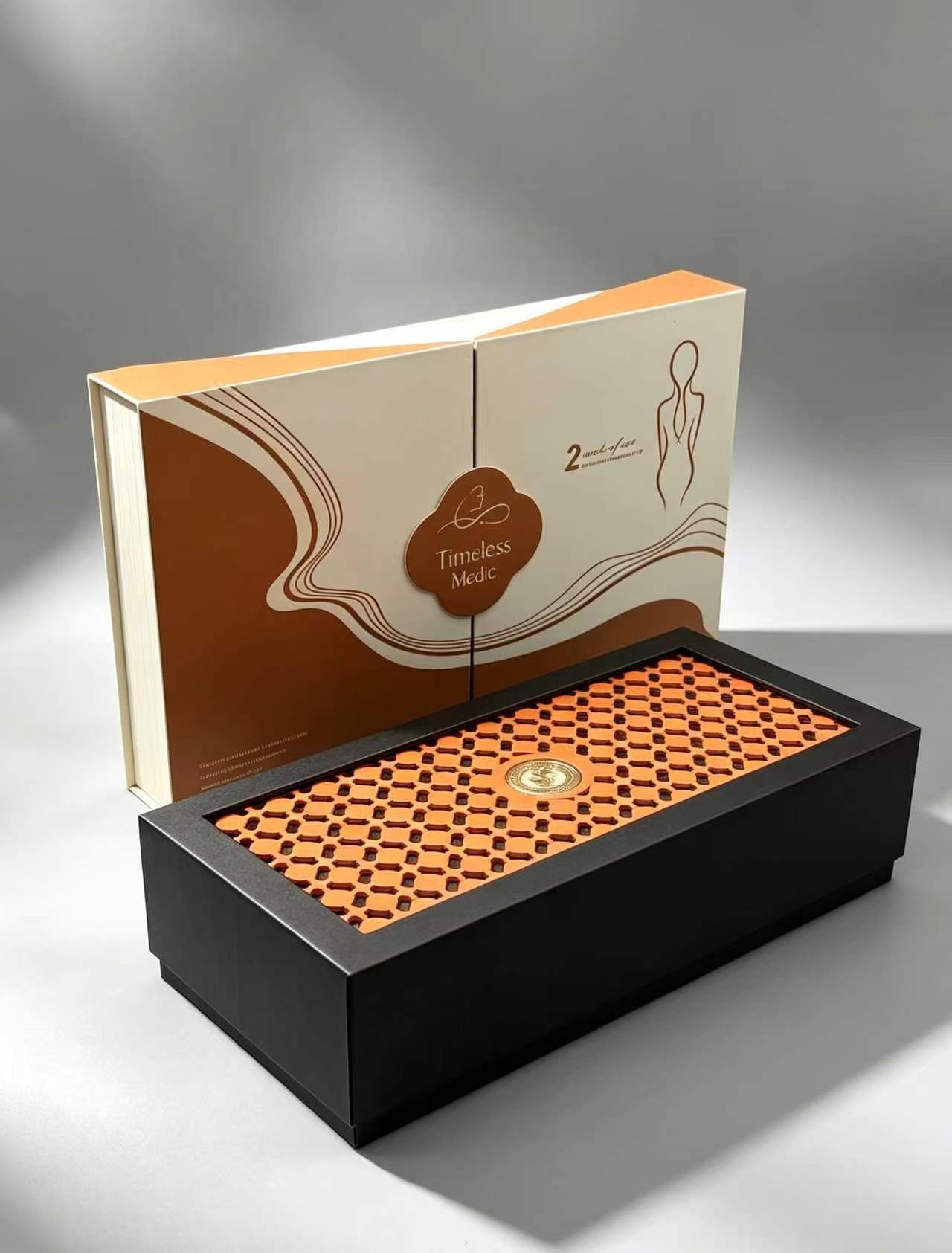Stylish Black & Orange Hollow Carved Magnetic Box with Gold Emblem for Luxury Cosmetics